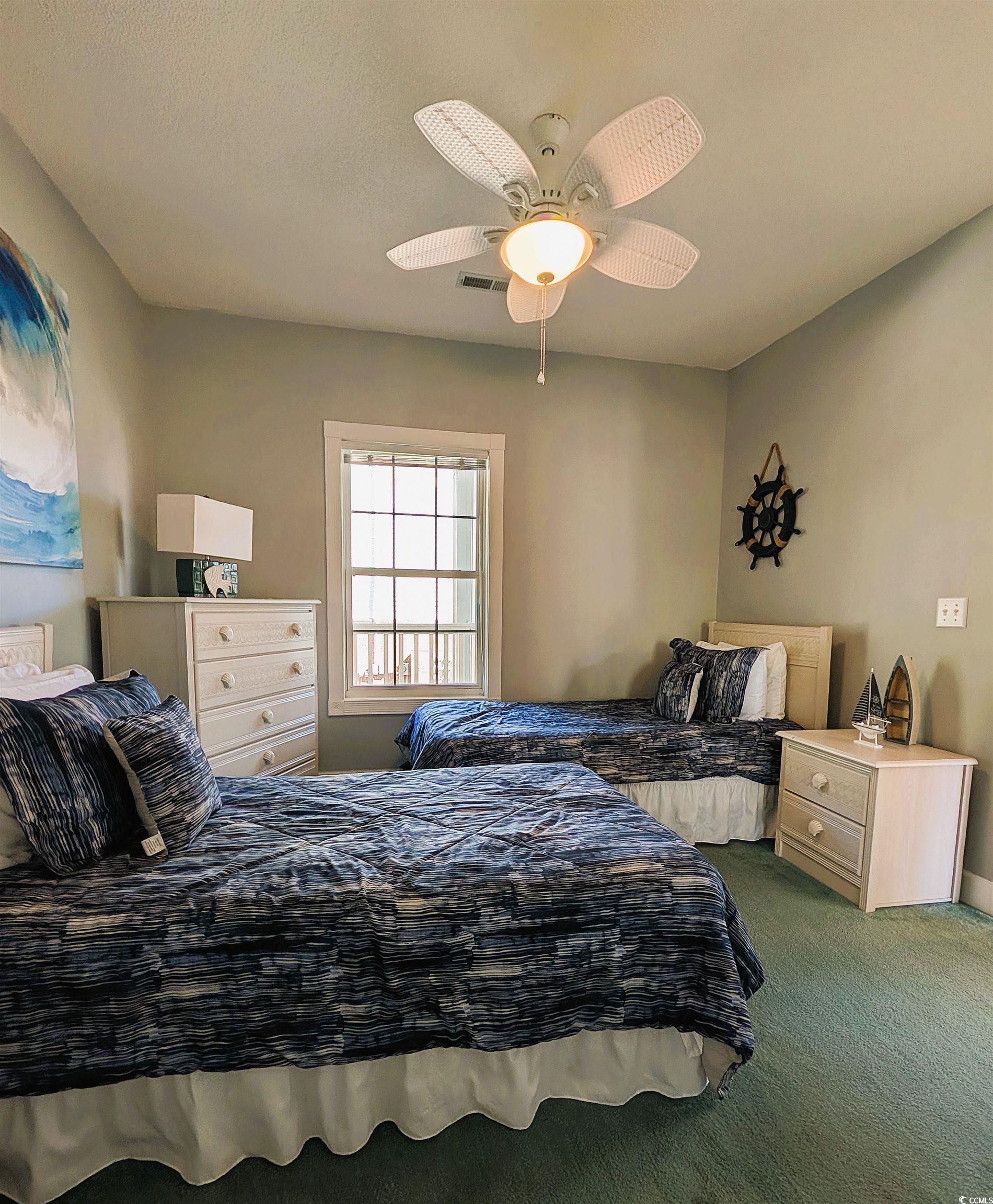 1512 Lanterns Rest Road, Unit 201 Myrtle Beach, SC 29579 - Photo 8 of 23 Carpeted bedroom featuring ceiling fan