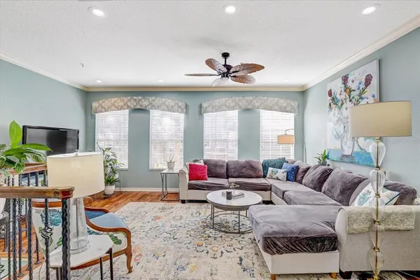 a living room with furniture and a large window