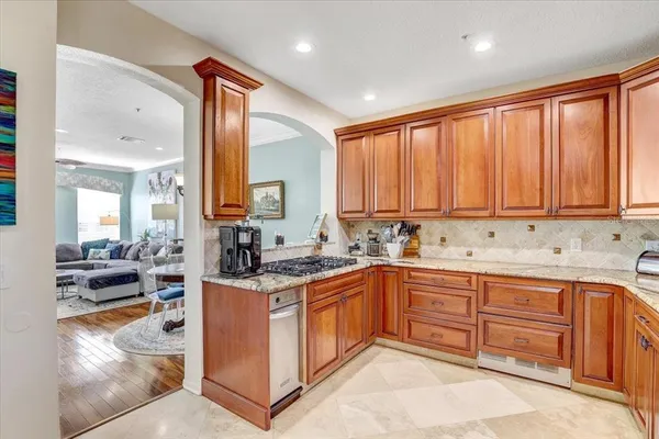 a kitchen with a sink stove and cabinets