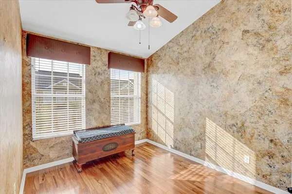 a bathroom with a wooden floor