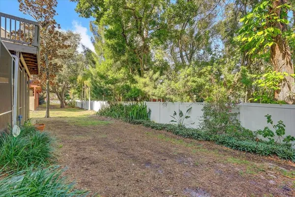 a front view of a residential apartment building with a yard