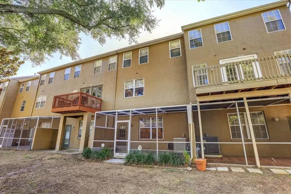 a front view of a residential apartment building with a yard