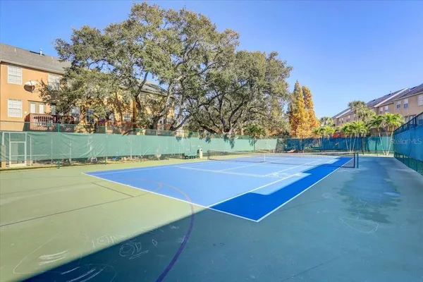 a view of a swimming pool with sitting area