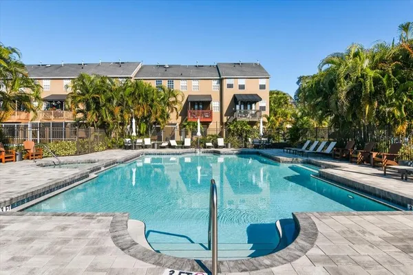 a view of a yard with plants and trees