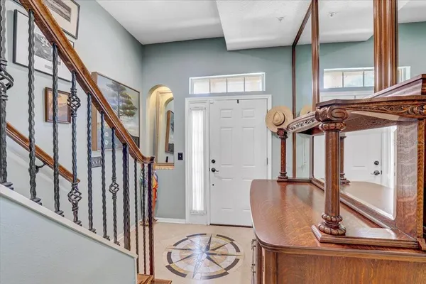 a view of staircase with wooden floor and a potted plant