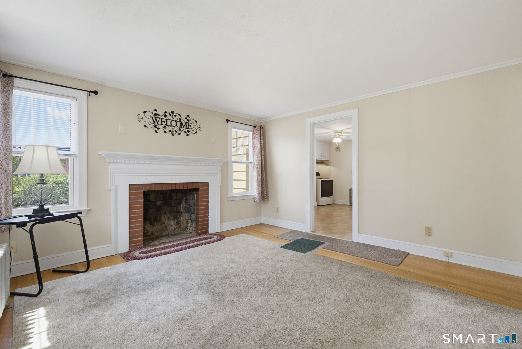 417 Hartford Road Manchester, CT 06040 - Photo 13 of 38 Windows on each side of the fireplace bring daylight into this room throughout the day.