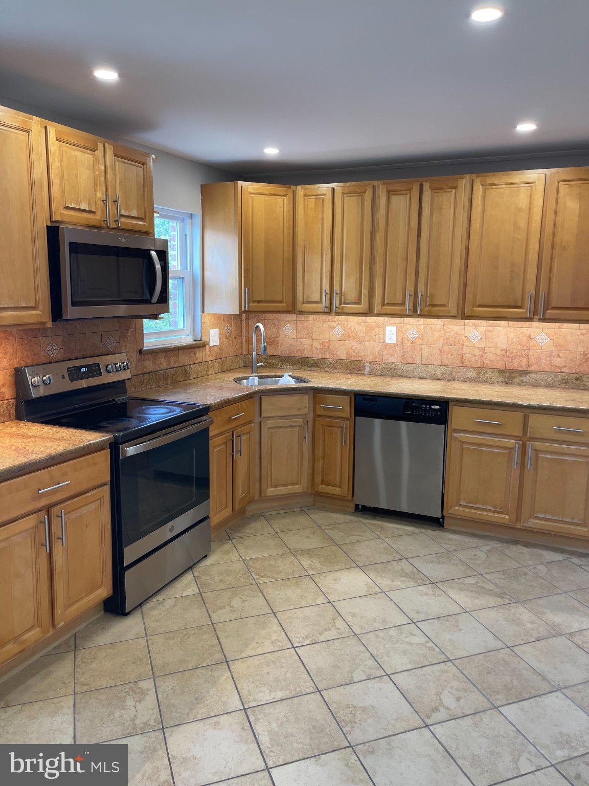 2333 Ripley Street Philadelphia, PA 19152 - Photo 8 of 41 Modern kitchen with warm wood tones.