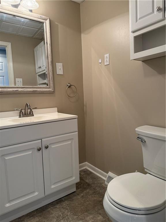19 Studa Street, Unit 1 Burgettstown, PA 15021 - Photo 8 of 13 a bathroom with a toilet a sink and mirror