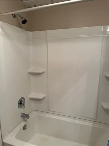 a bathroom with a white bath tub
