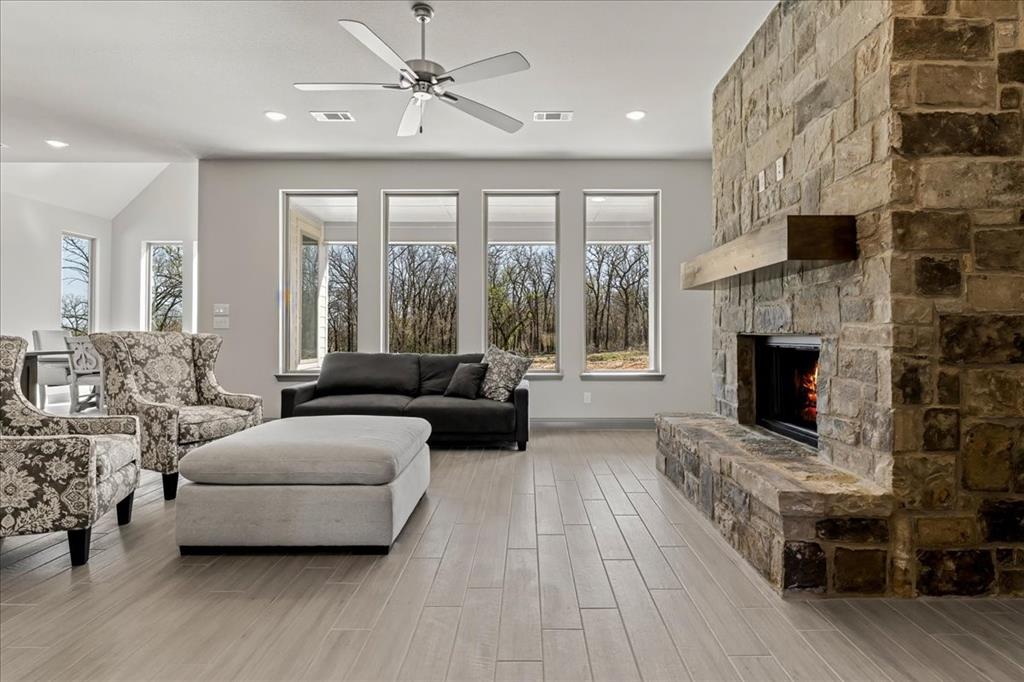 131 Spring Valley Road Paradise, TX 76073 - Photo 4 of 40 a living room with furniture and a fireplace