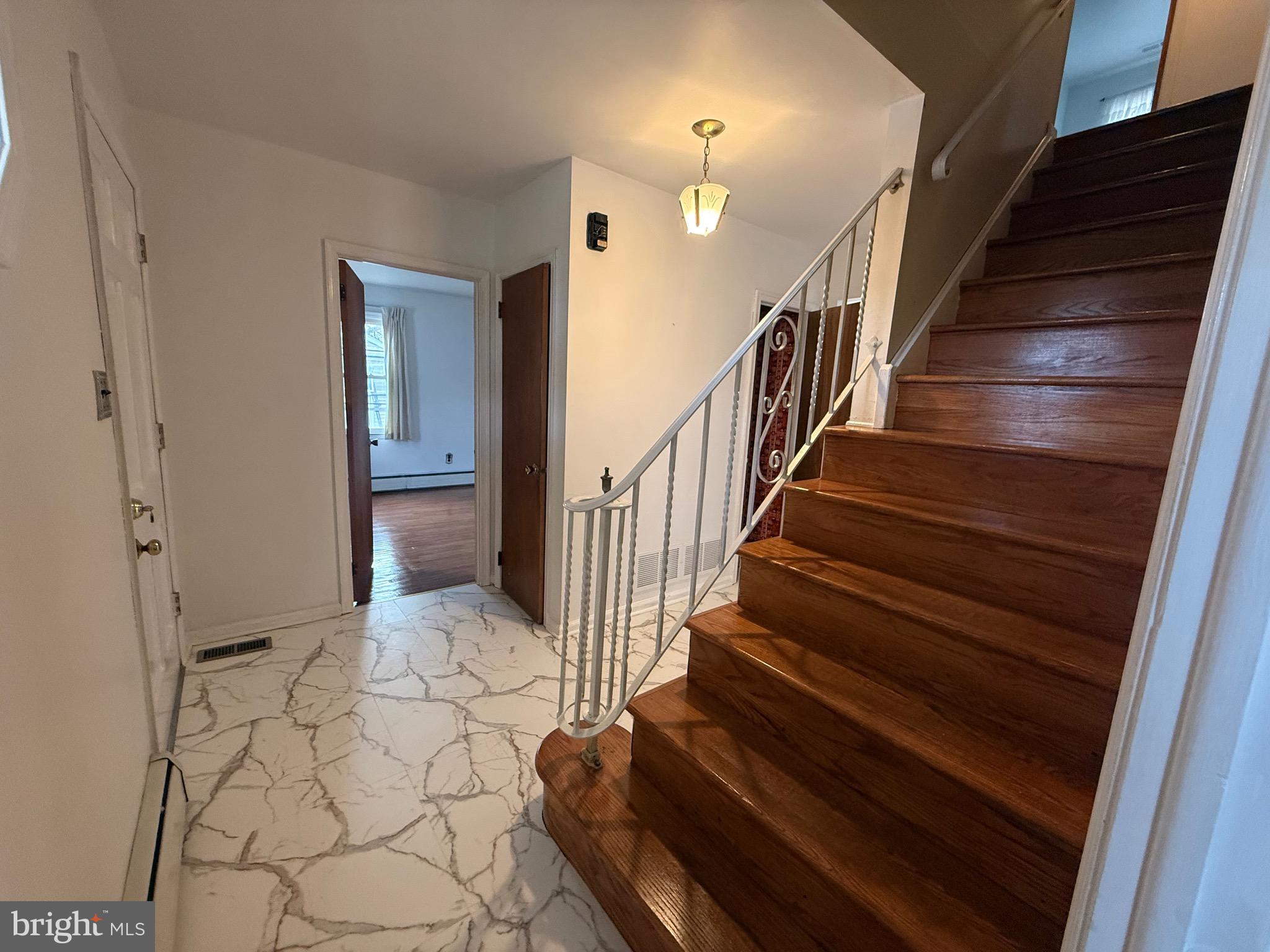 338 Rees Drive King of Prussia, PA 19406 - Photo 3 of 35 a view of entryway and hall with wooden floor
