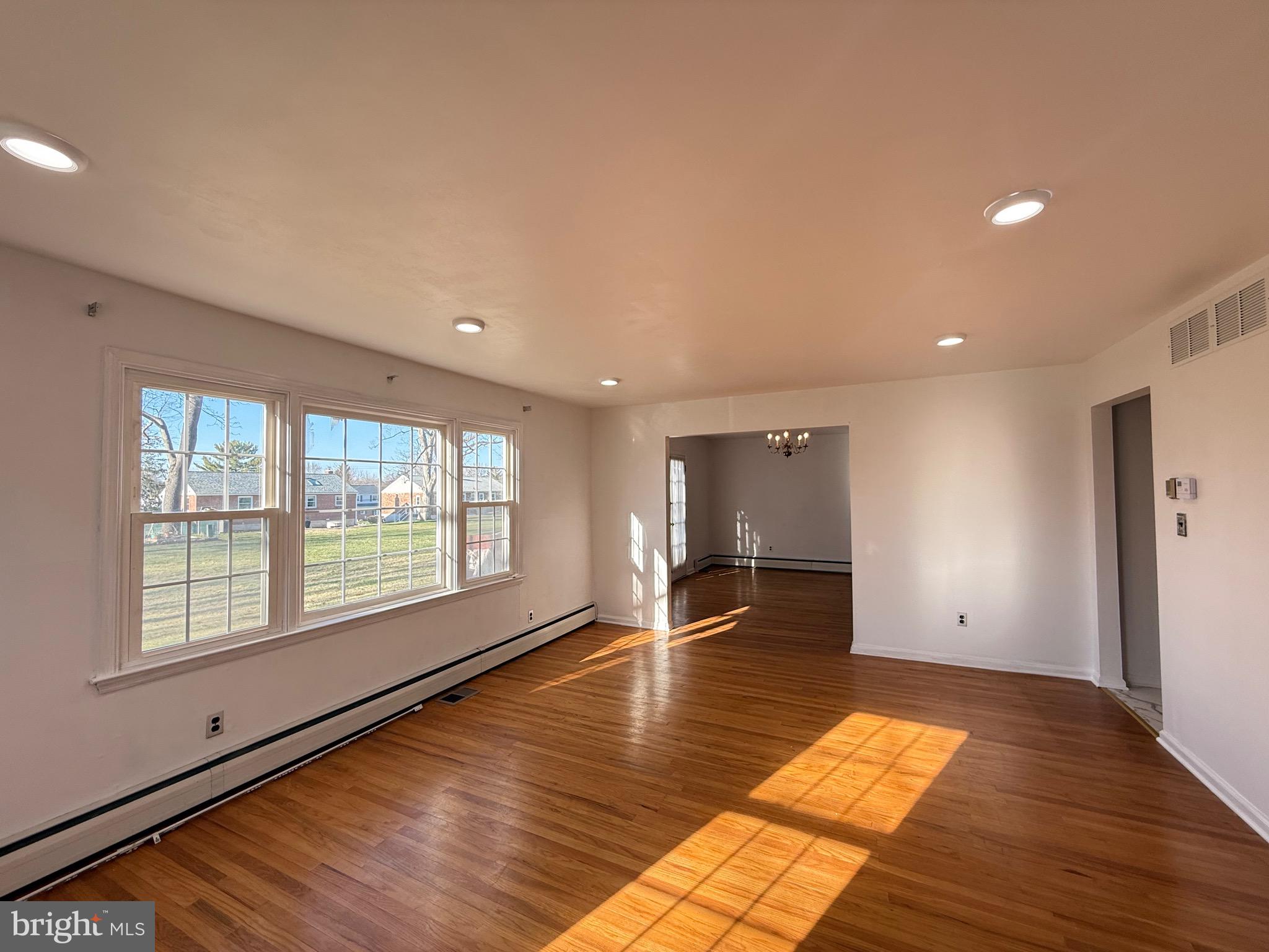338 Rees Drive King of Prussia, PA 19406 - Photo 8 of 35 a view of empty room with wooden floor and fan