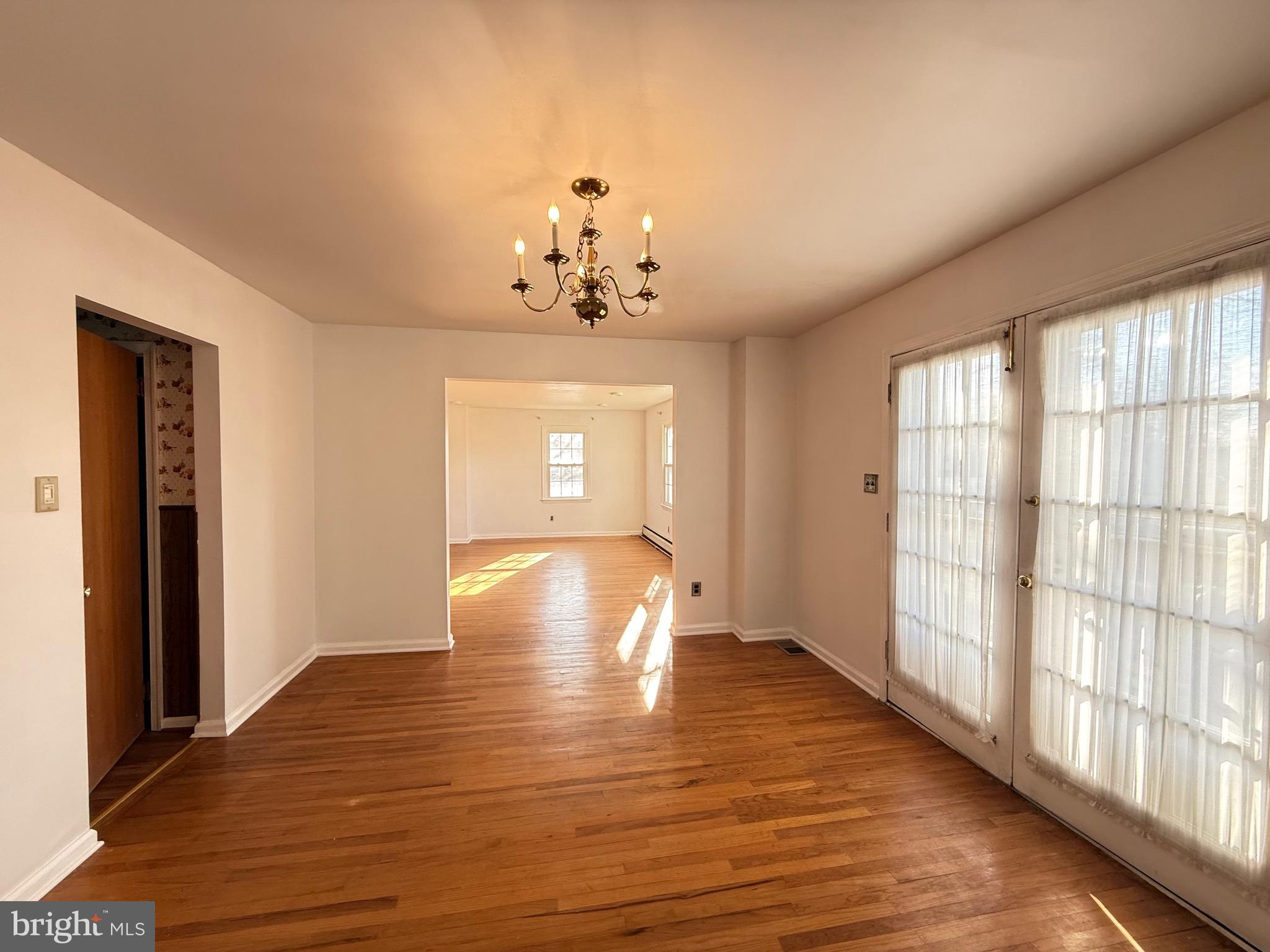 338 Rees Drive King of Prussia, PA 19406 - Photo 9 of 35 a view of empty room with wooden floor and fan