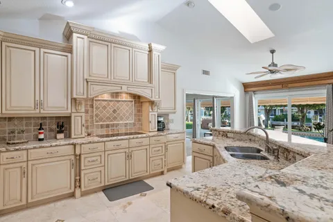 a kitchen with sink cabinets and outdoor view