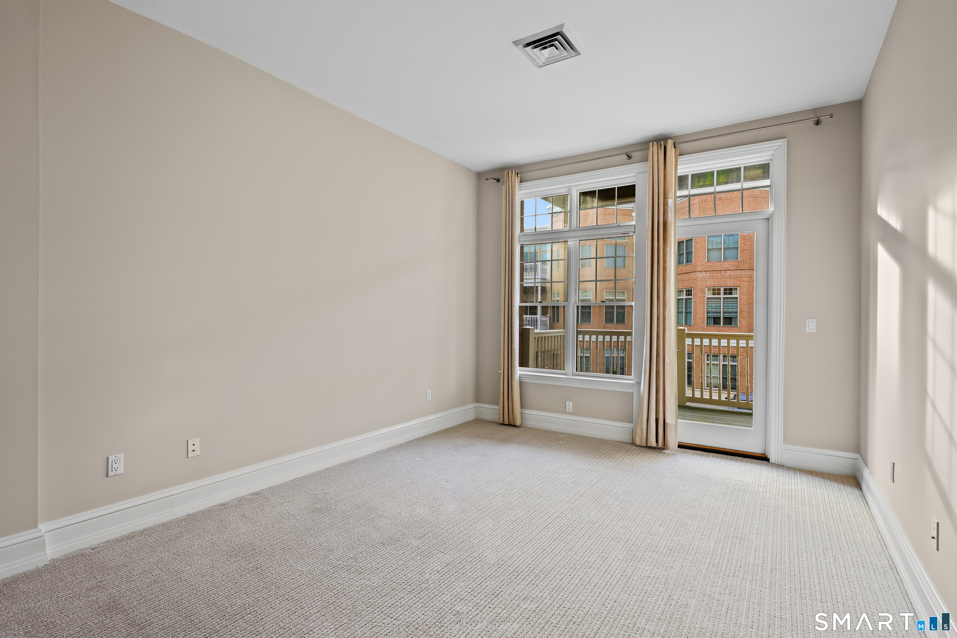50 Stone Ridge Way, Unit 2A Fairfield, CT 06824 - Photo 16 of 36 a view of an empty room with a window