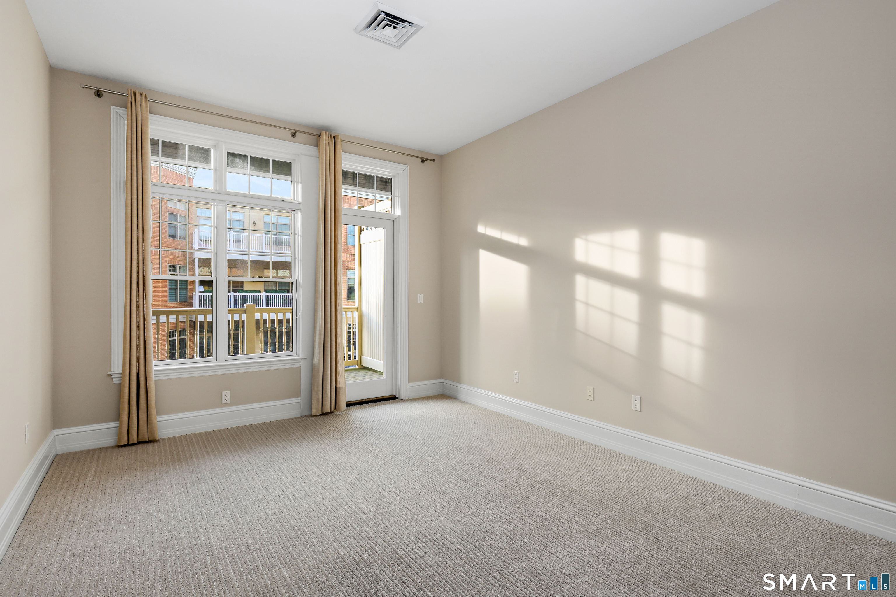 50 Stone Ridge Way, Unit 2A Fairfield, CT 06824 - Photo 17 of 36 a view of an empty room with a window