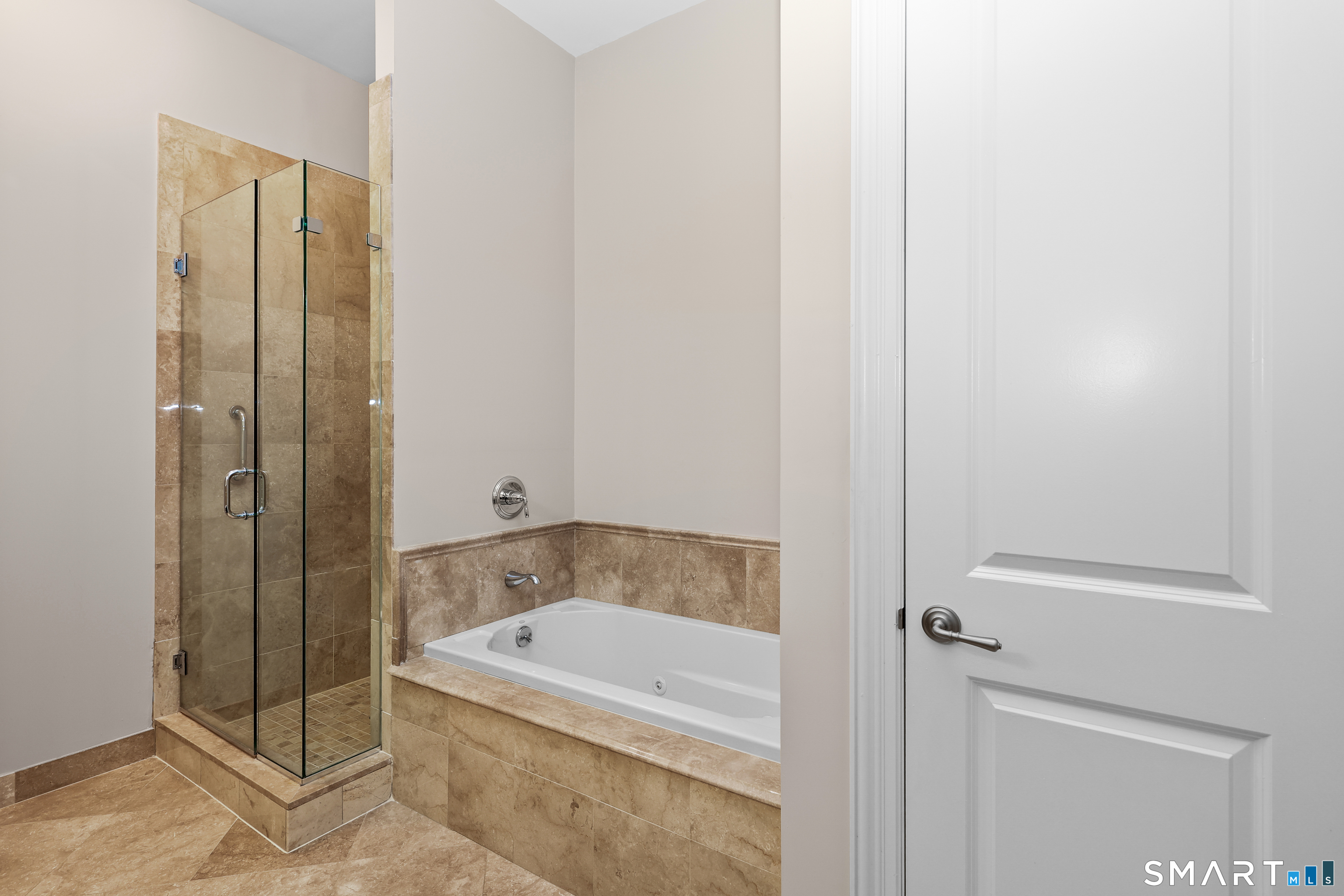 50 Stone Ridge Way, Unit 2A Fairfield, CT 06824 - Photo 22 of 36 a bathroom with a tub and shower