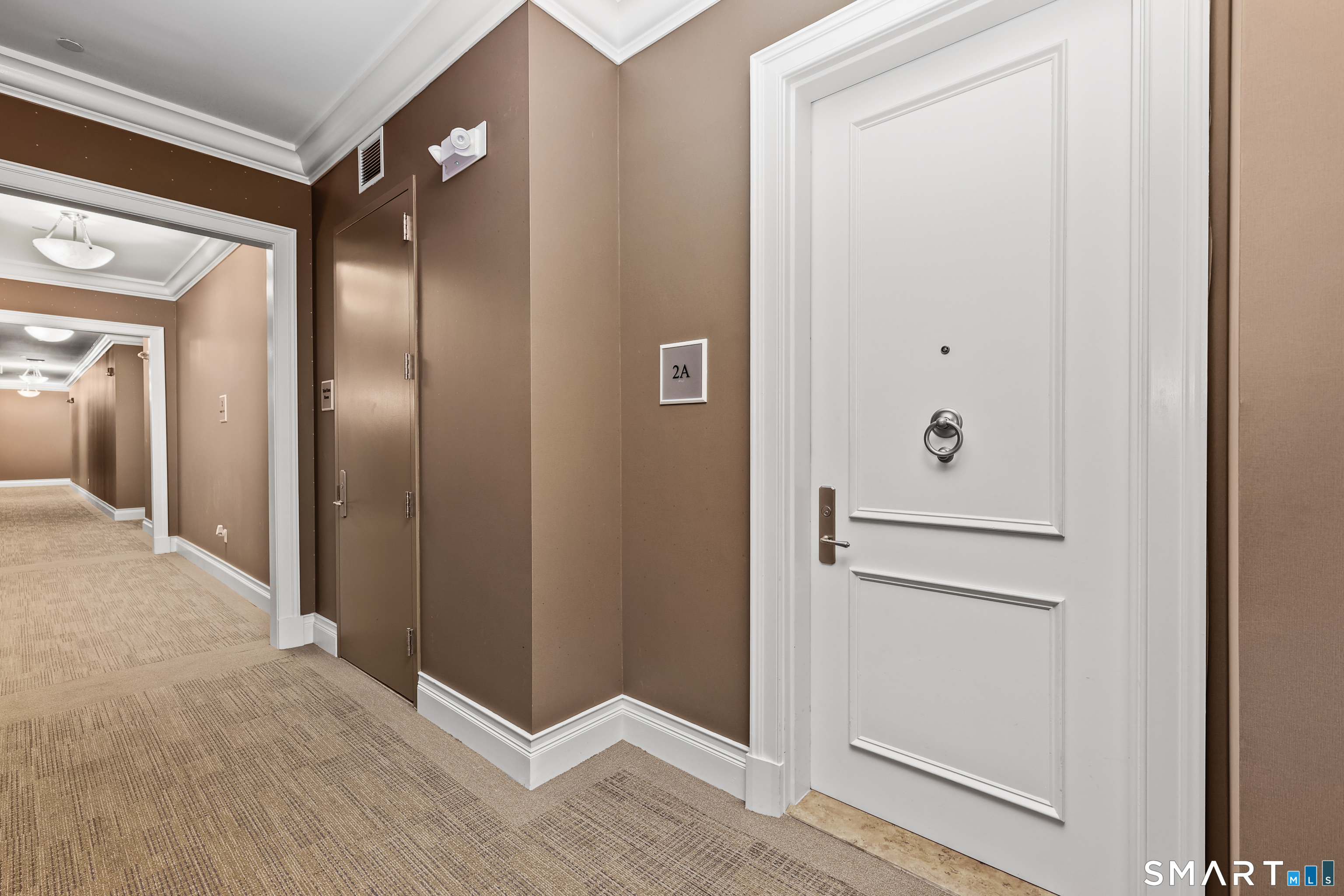 50 Stone Ridge Way, Unit 2A Fairfield, CT 06824 - Photo 25 of 36 a view of a hallway with wooden floor
