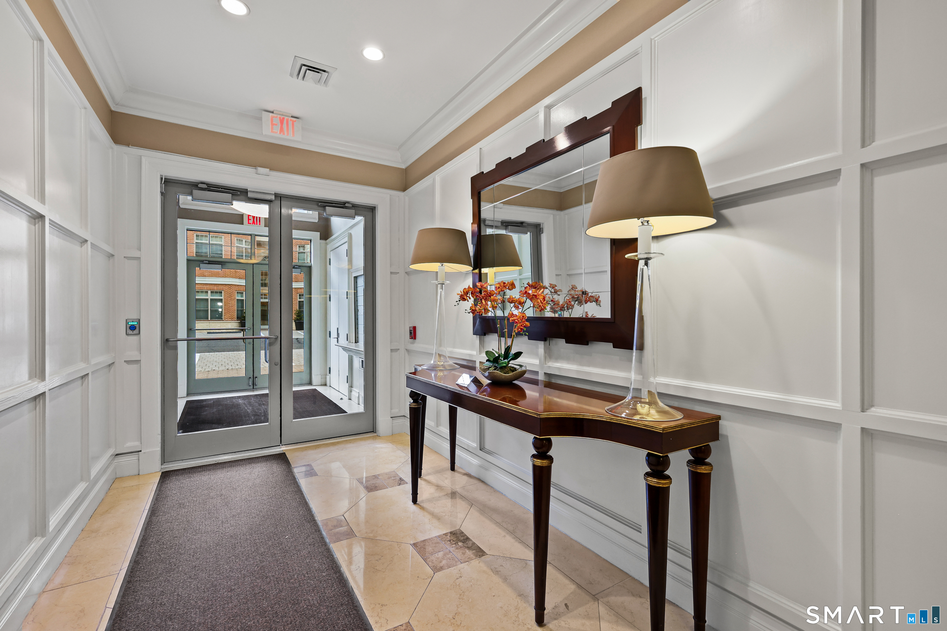 50 Stone Ridge Way, Unit 2A Fairfield, CT 06824 - Photo 27 of 36 a view of a hallway with furniture and window