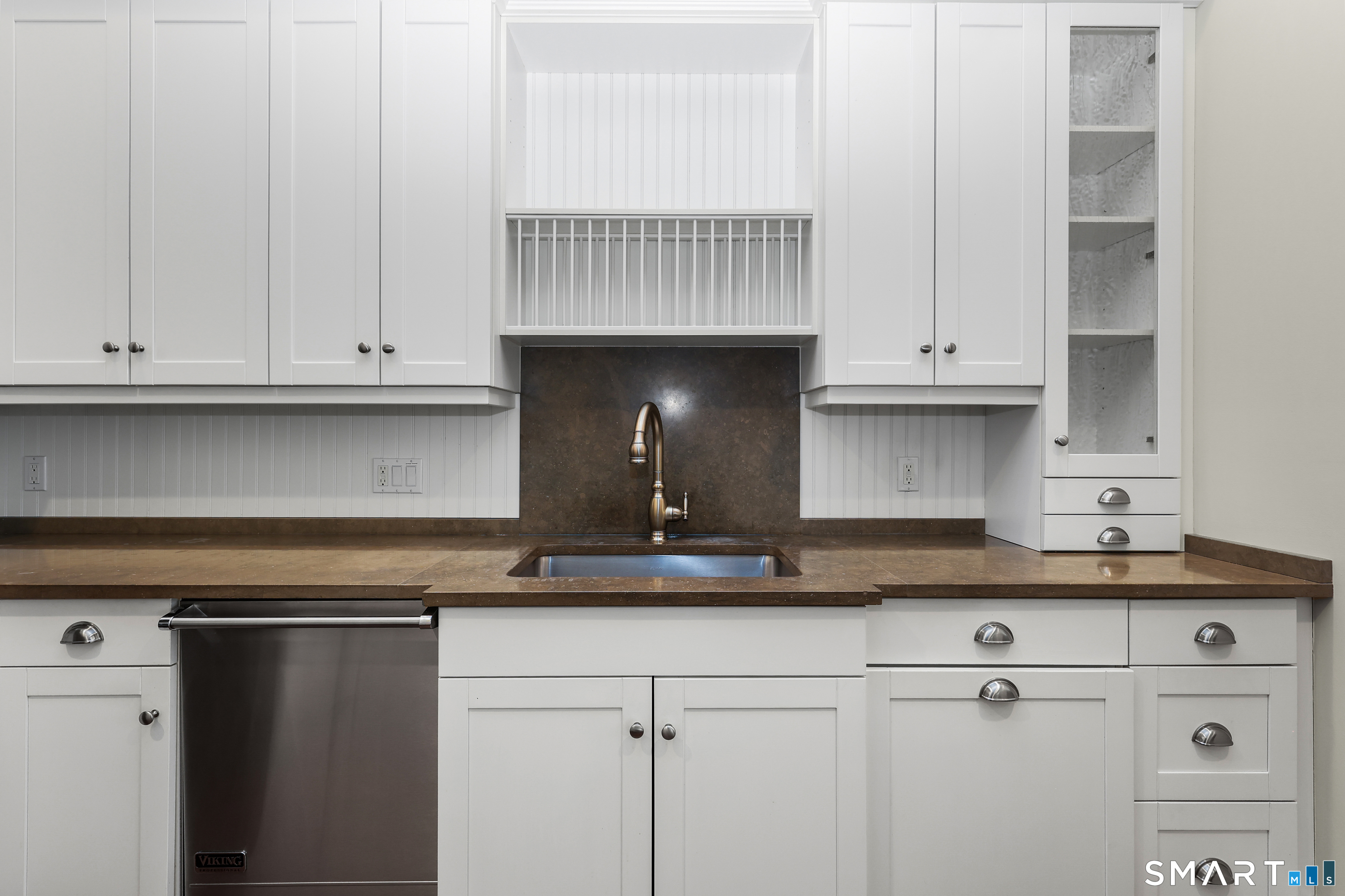 50 Stone Ridge Way, Unit 2A Fairfield, CT 06824 - Photo 8 of 36 a kitchen with granite countertop white cabinets and a sink