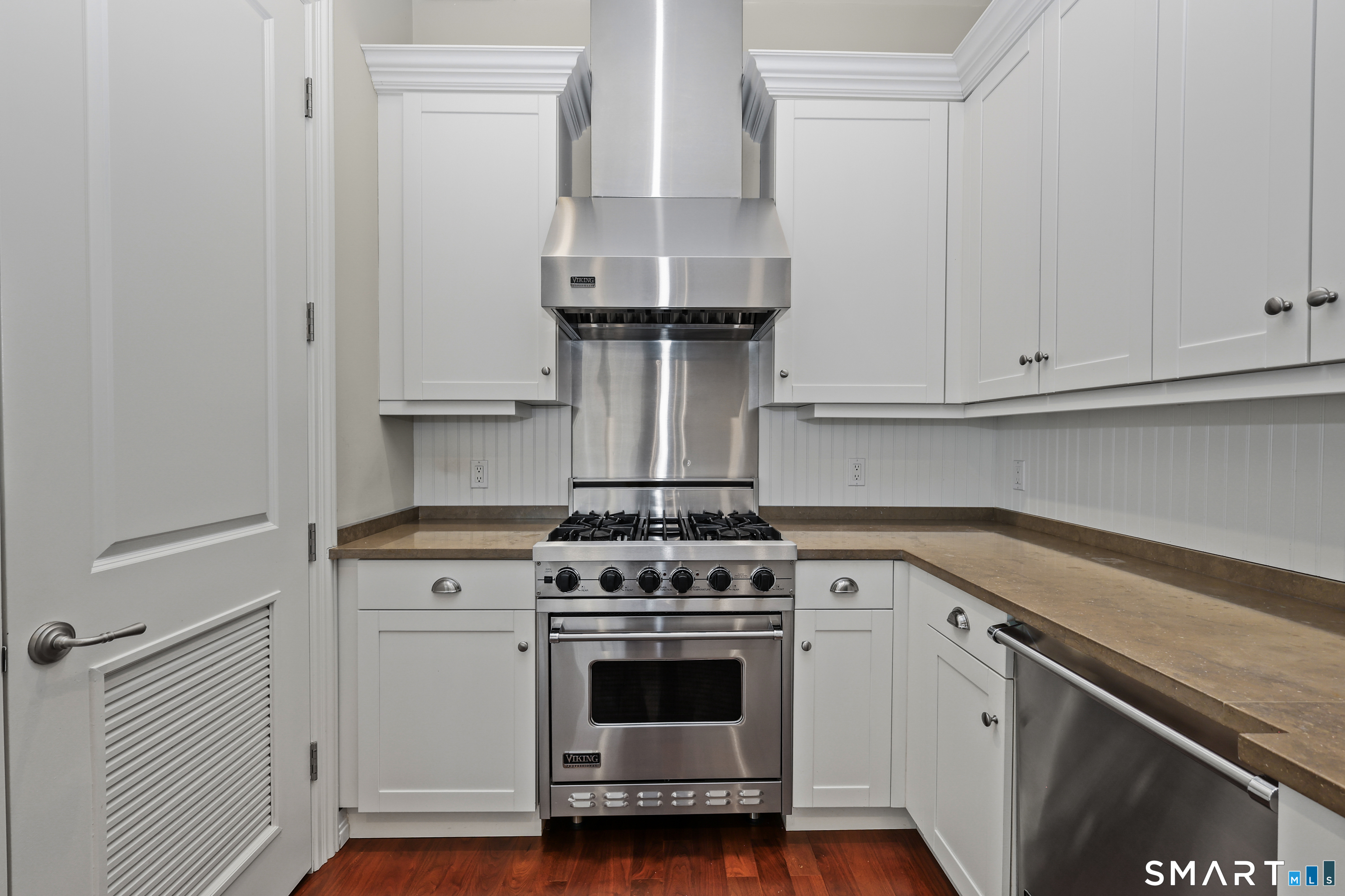 50 Stone Ridge Way, Unit 2A Fairfield, CT 06824 - Photo 10 of 36 a kitchen with white cabinets and appliances