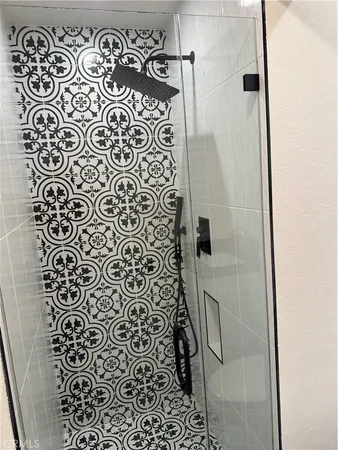 a bathroom with a shower and a shower curtain