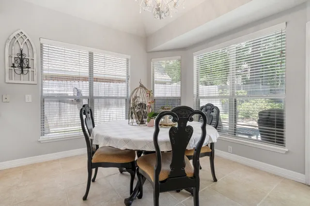 a view of a dining room with furniture and window