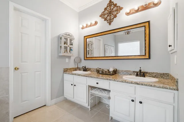 a bathroom with a sink a mirror and a toilet