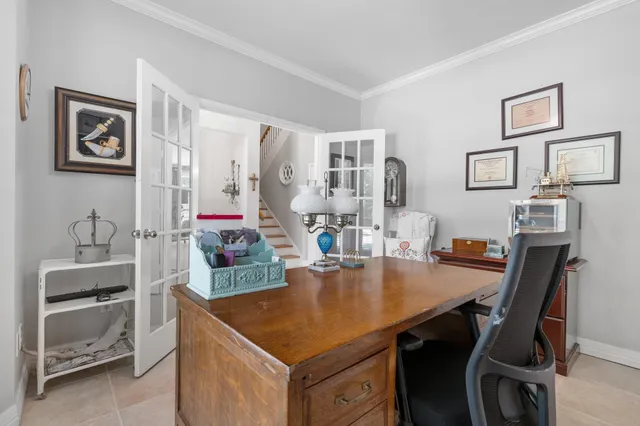 a dining room with table and chairs