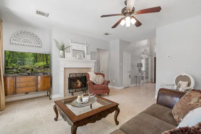 a living room with furniture and a fireplace