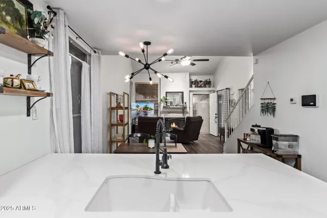 a room with lots of chairs and mirrors