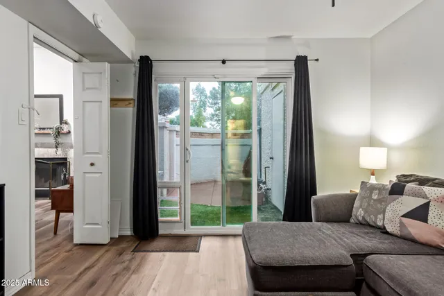 a living room with furniture and a large window