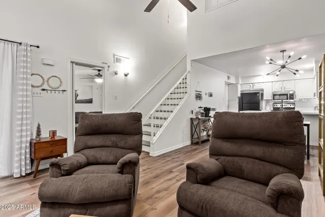 a living room with furniture and a potted plant