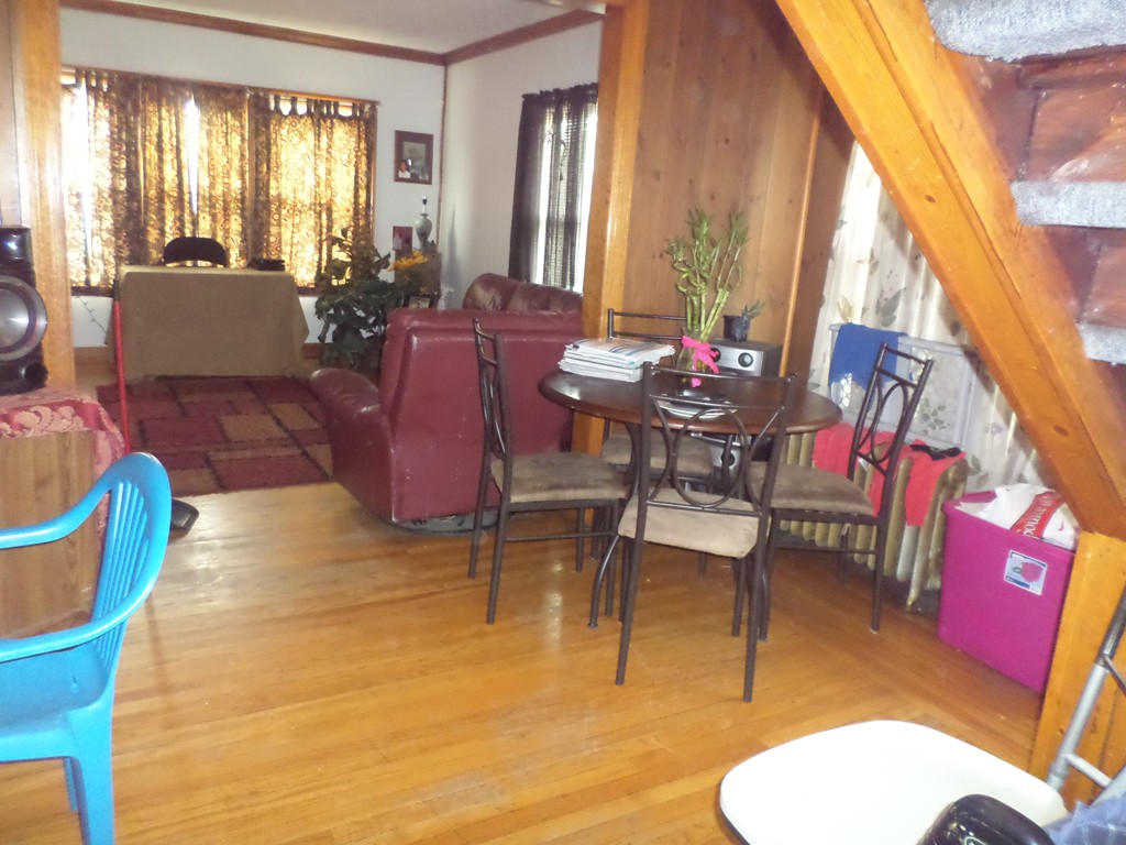 60-62 Merida Street Springfield, MA 01104 - Photo 13 of 22 a living room with furniture and a large window