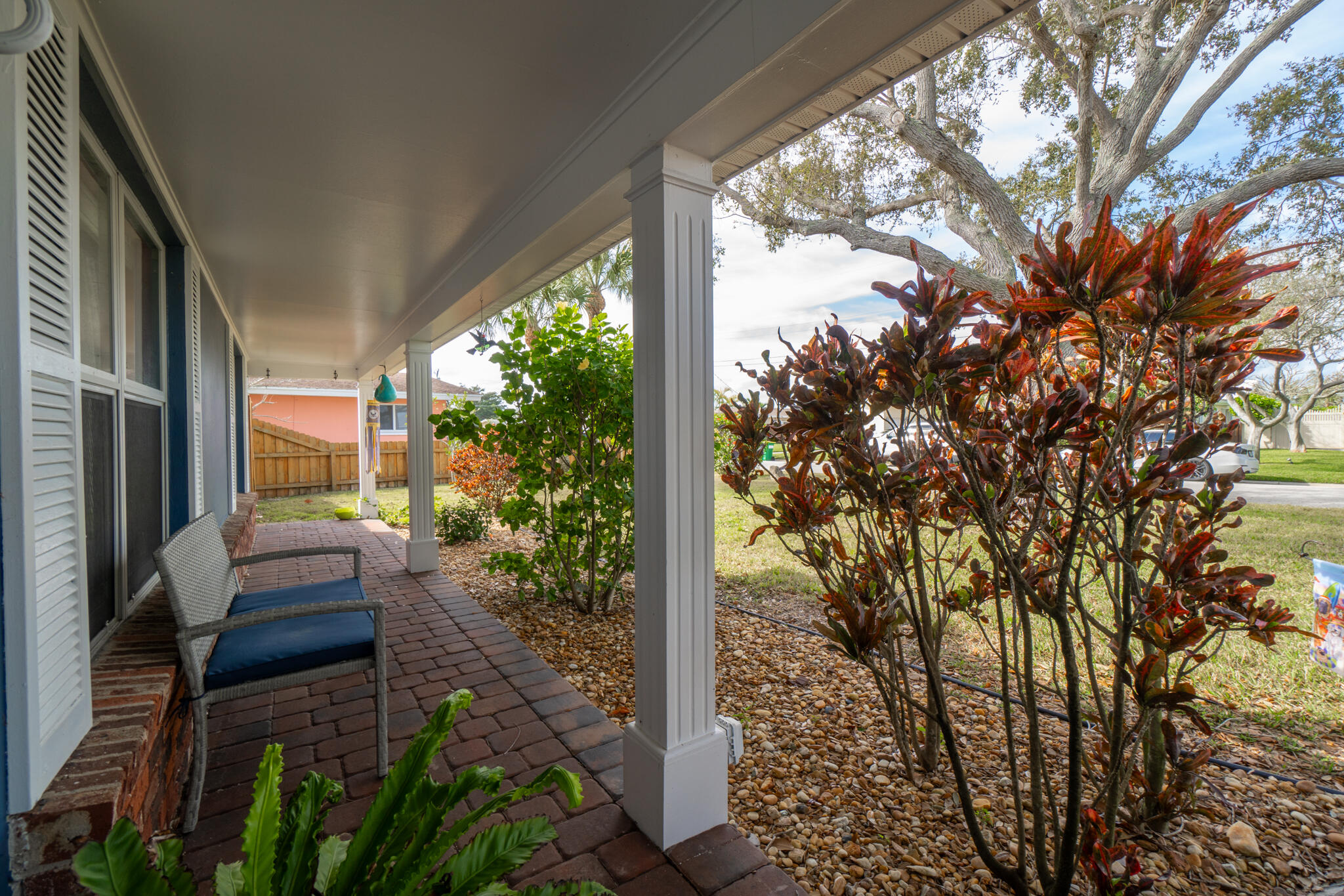 560 Capri Road Cocoa Beach, FL 32931 - Photo 14 of 31 a view of a porch with furniture and garden