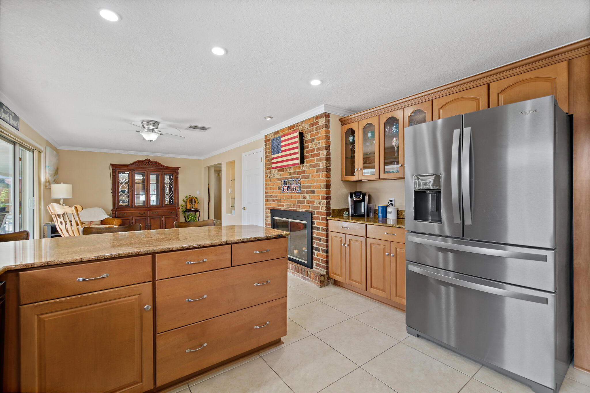 560 Capri Road Cocoa Beach, FL 32931 - Photo 20 of 31 a kitchen with stainless steel appliances granite countertop a refrigerator and cabinets