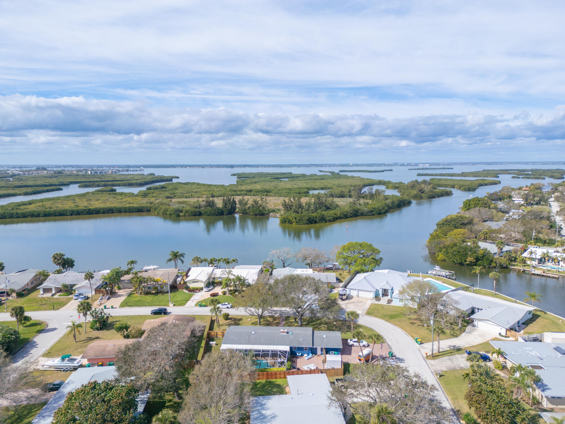 560 Capri Road Cocoa Beach, FL 32931 - Photo 29 of 31 an aerial view of lake and residential houses with outdoor space