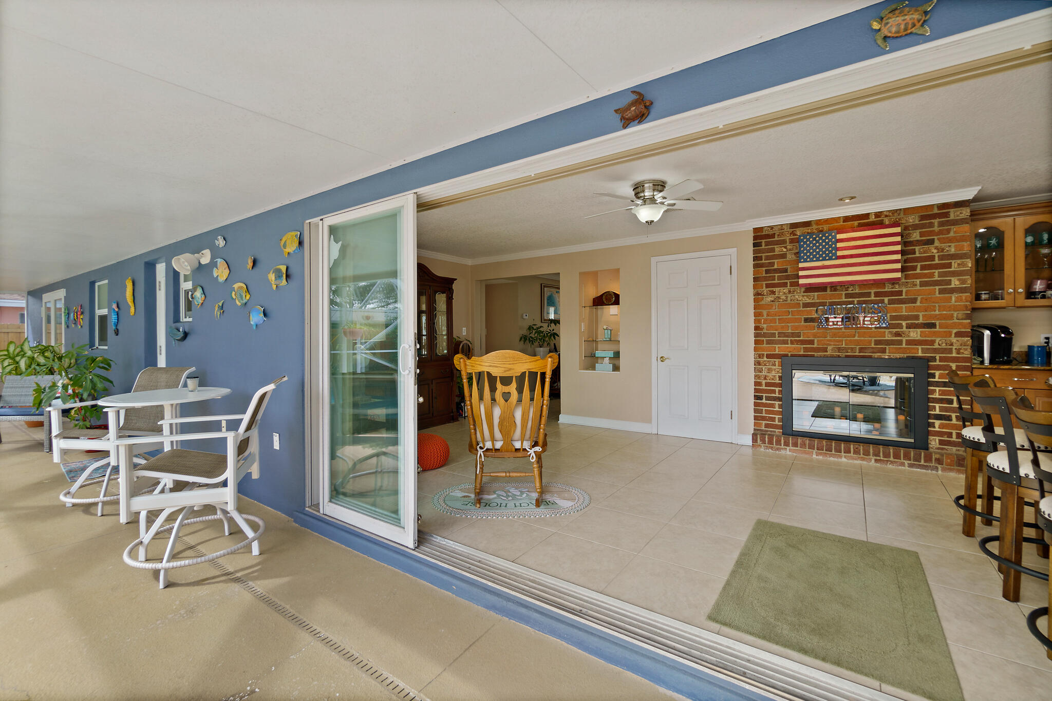 560 Capri Road Cocoa Beach, FL 32931 - Photo 5 of 31 a view of a livingroom with furniture and a wooden floor