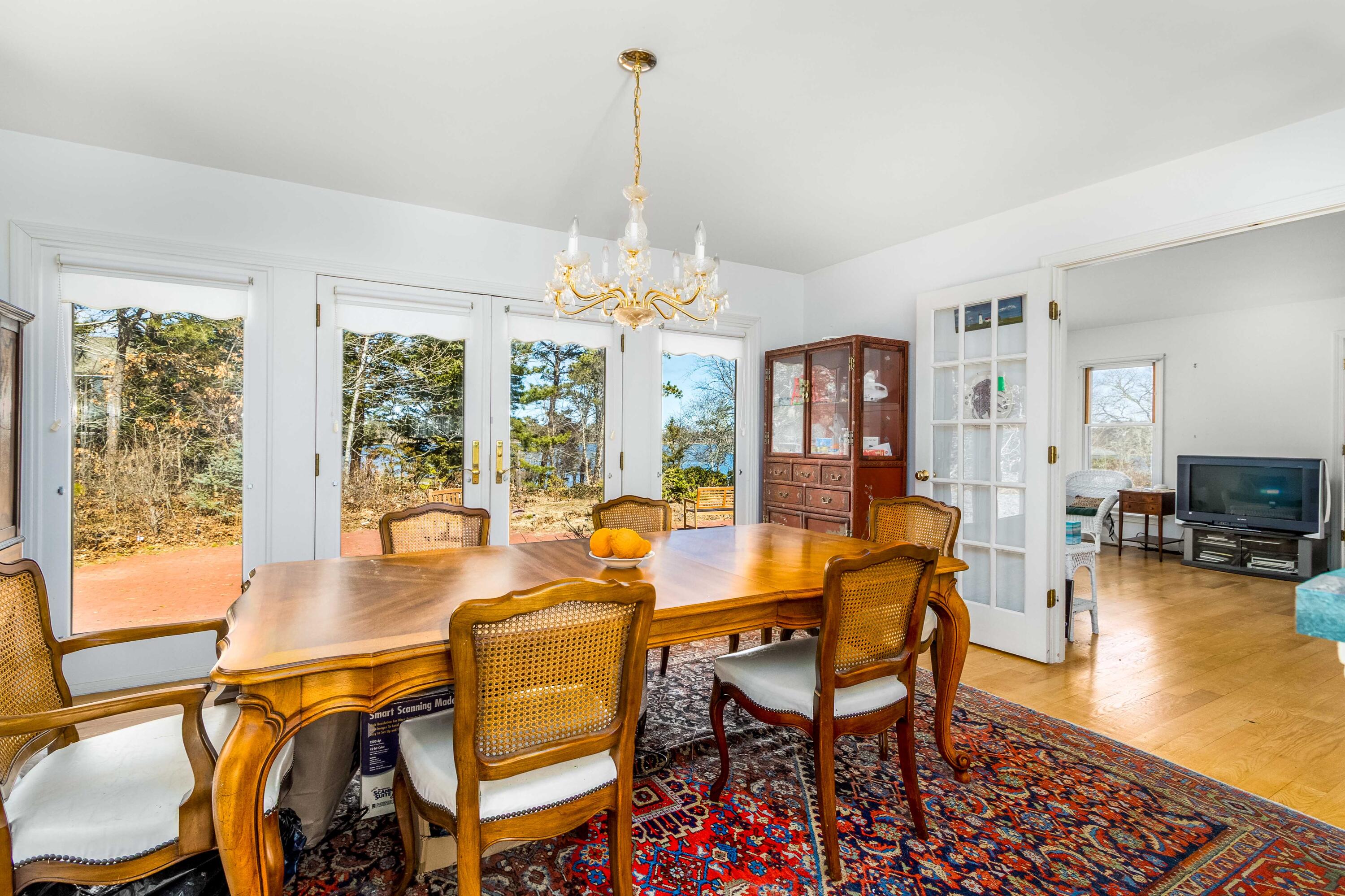 104 Seapine Road North Chatham, MA 02650 - Photo 15 of 36 a view of a dining room with furniture window and wooden floor