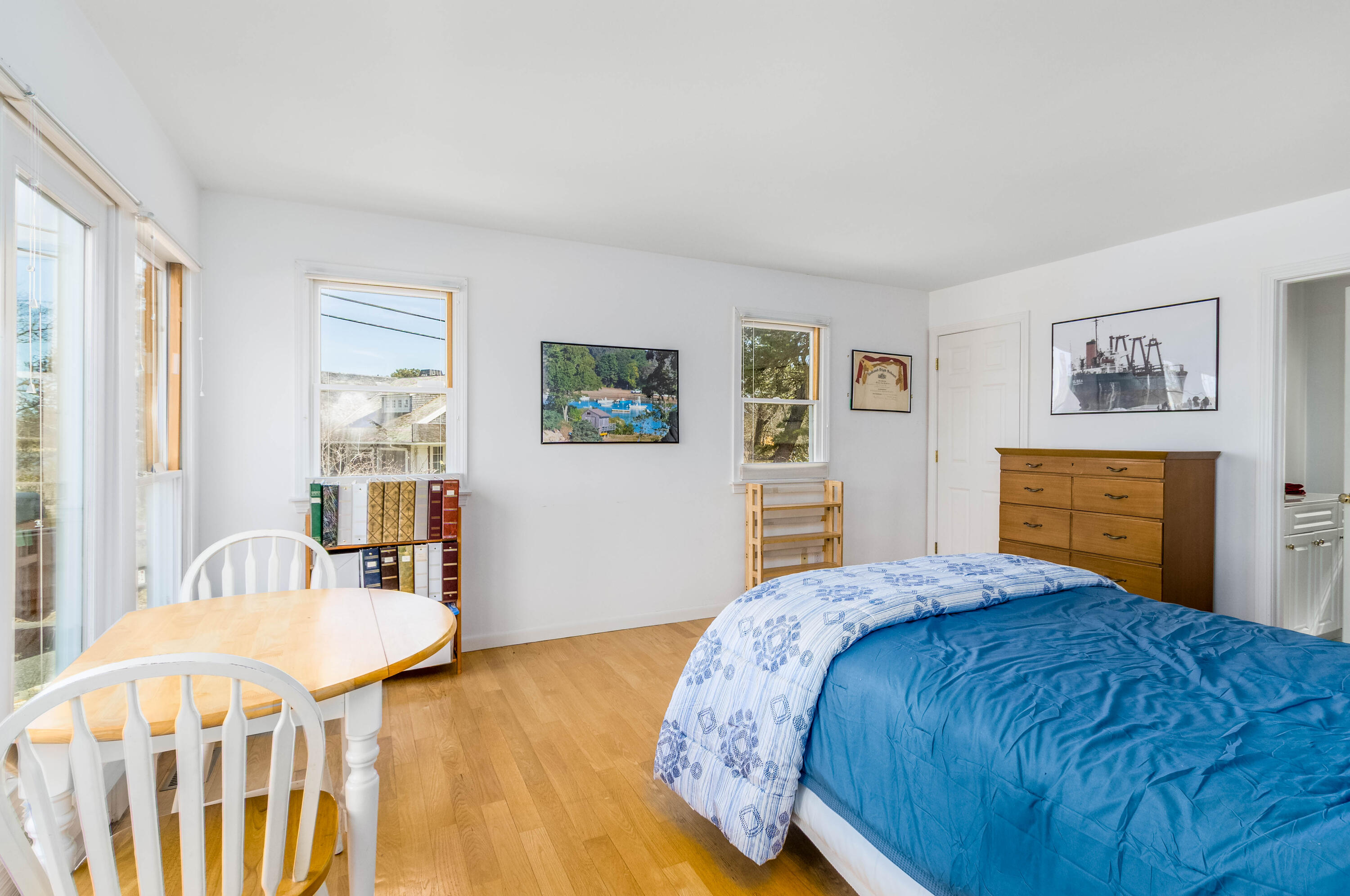 104 Seapine Road North Chatham, MA 02650 - Photo 21 of 36 a bedroom with a bed and dresser with wooden floor