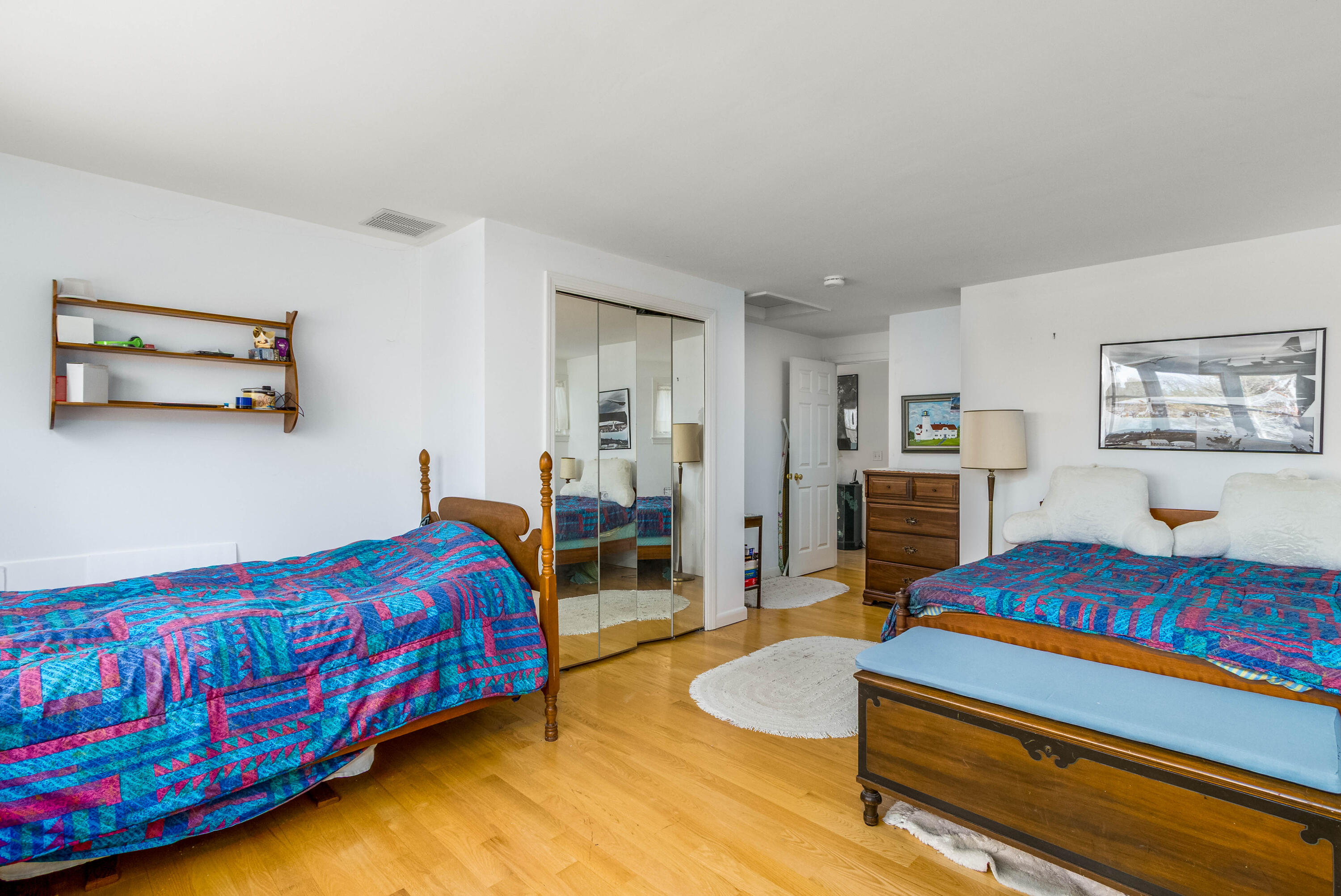 104 Seapine Road North Chatham, MA 02650 - Photo 24 of 36 a bedroom with a bed and a chandelier