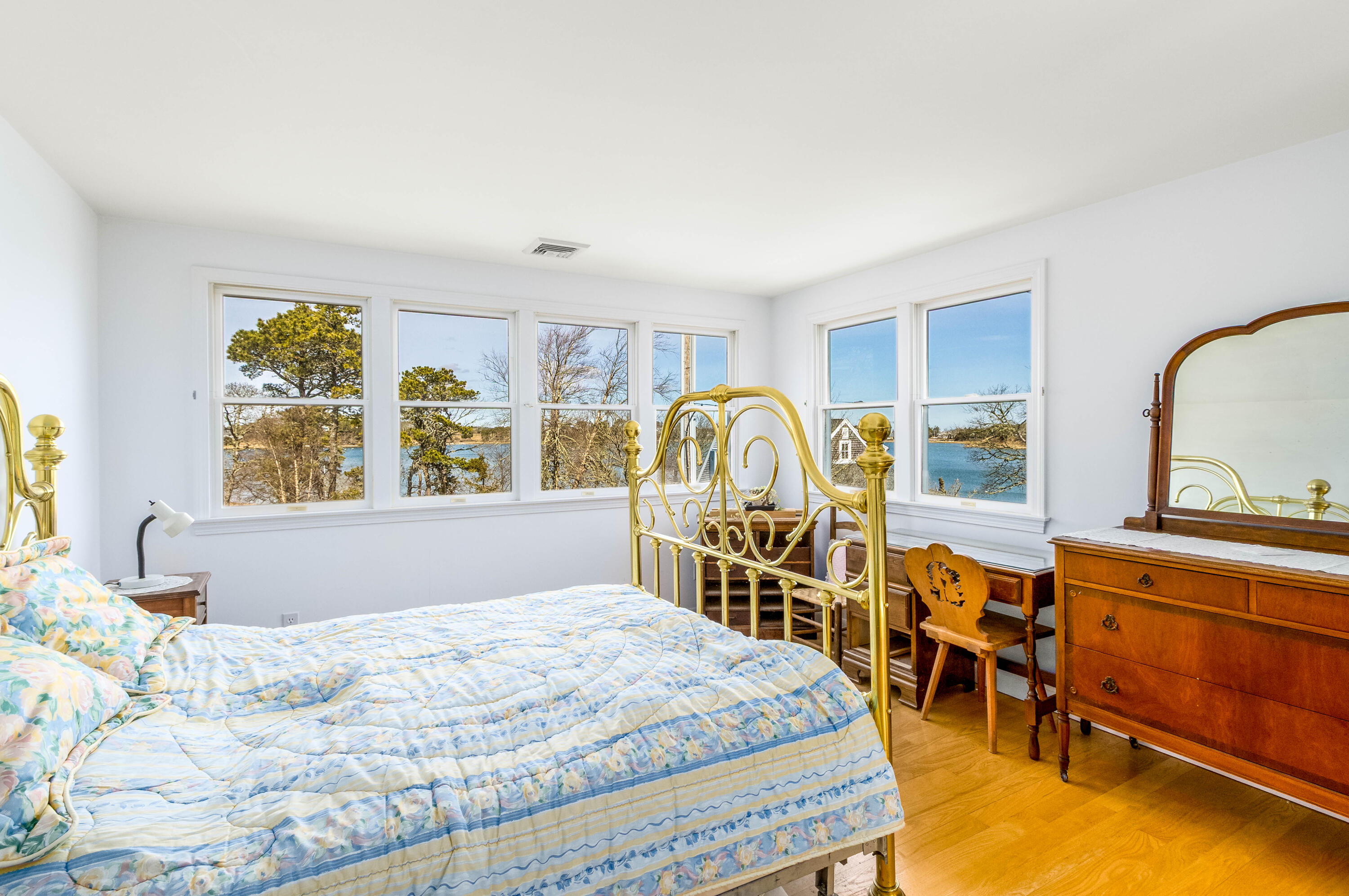 104 Seapine Road North Chatham, MA 02650 - Photo 25 of 36 a bedroom with a large bed and a large window with the outer view