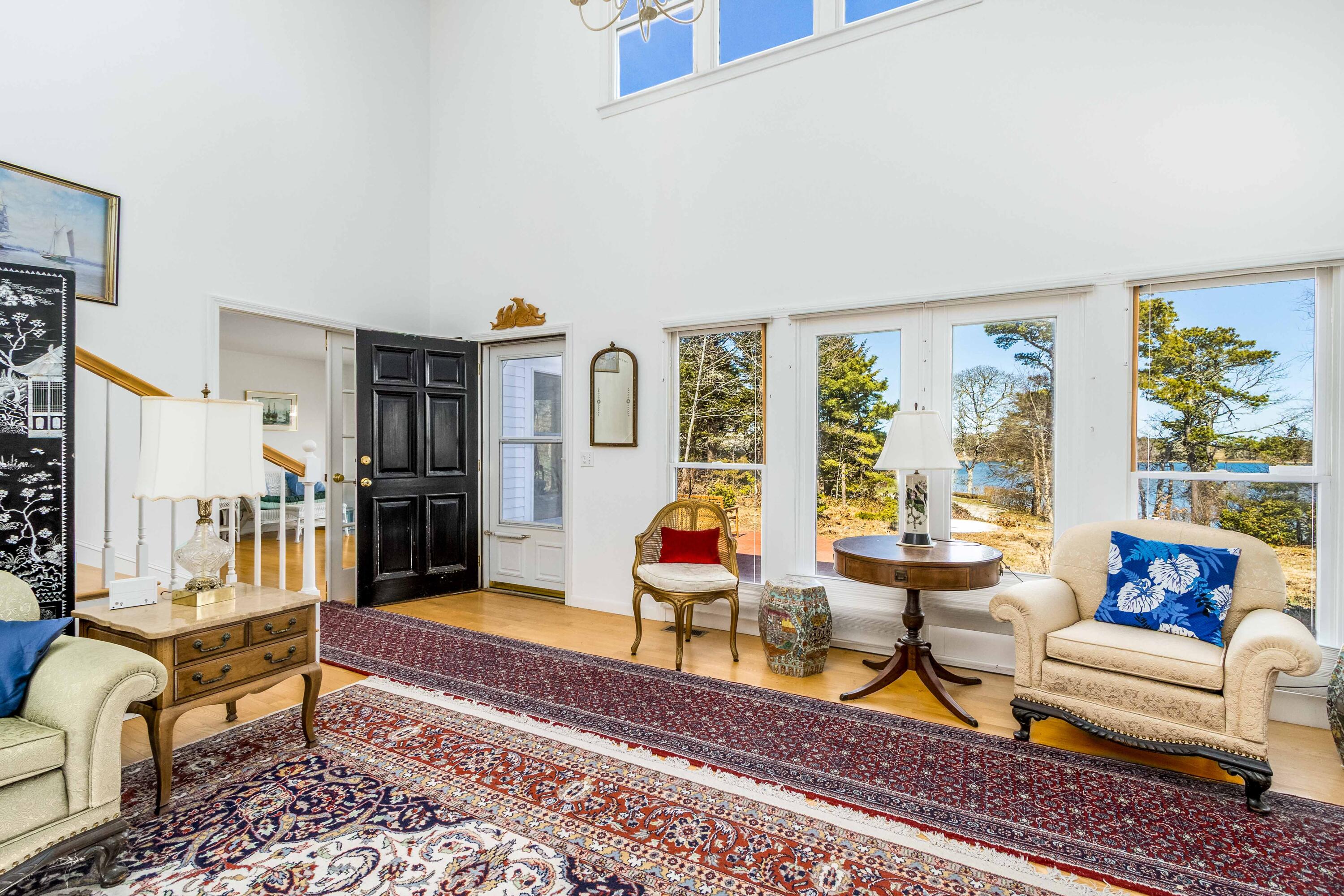 104 Seapine Road North Chatham, MA 02650 - Photo 7 of 36 a living room with furniture floor to ceiling window and a rug