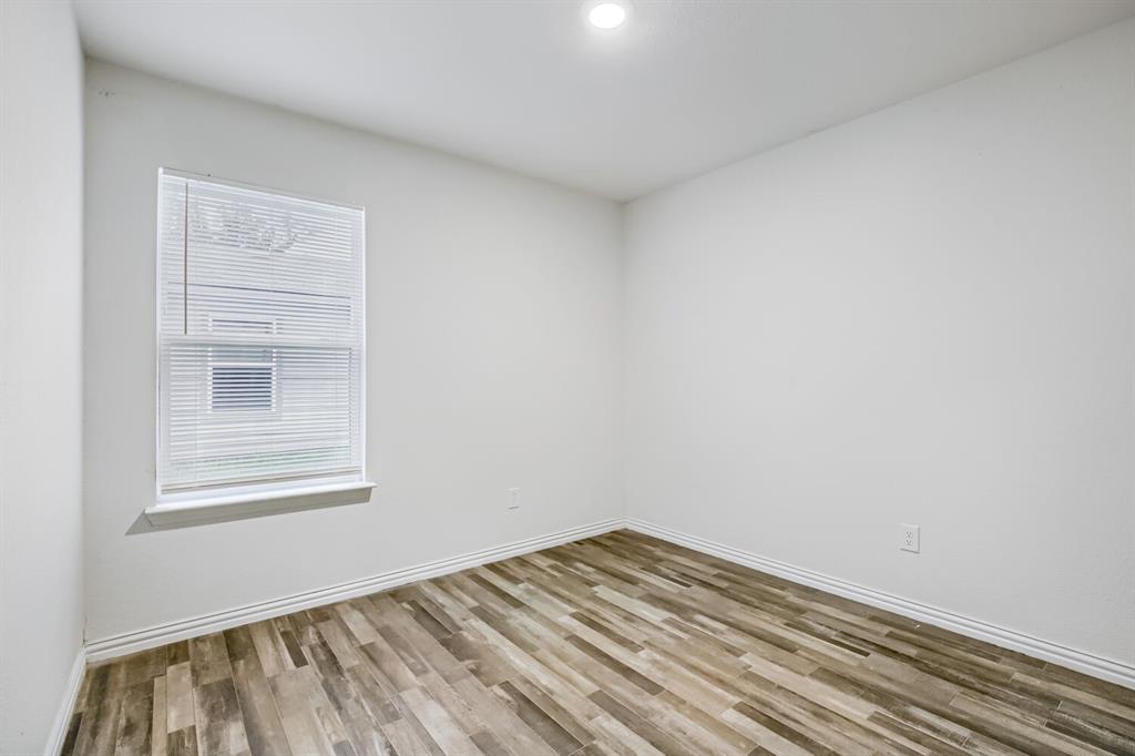 903 Olive Street Waco, TX 76704 - Photo 13 of 15 a view of empty room with wooden floor