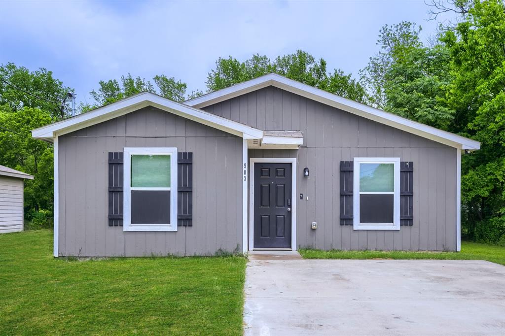 903 Olive Street Waco, TX 76704 - Photo 4 of 15 a view of a house with a yard