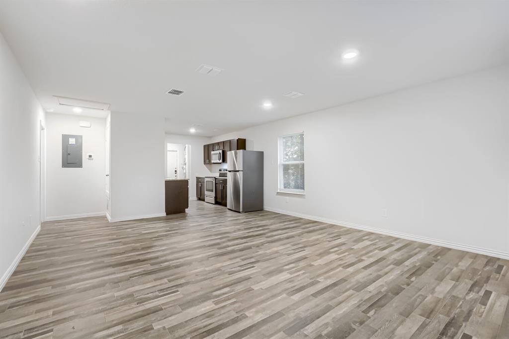 903 Olive Street Waco, TX 76704 - Photo 5 of 15 a view of empty room with wooden floor