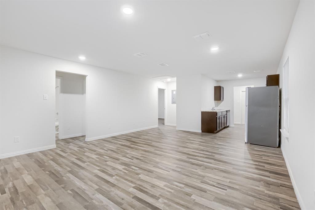 903 Olive Street Waco, TX 76704 - Photo 6 of 15 a view of empty room with wooden floor