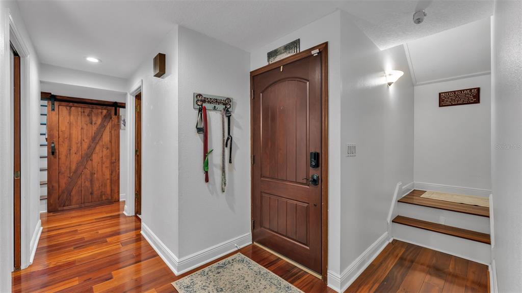 1804 Michelle Lane Lakeland, FL 33813 - Photo 11 of 83 a view of a hallway with closet and wooden floor