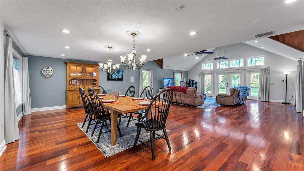 1804 Michelle Lane Lakeland, FL 33813 - Photo 16 of 83 a view of a dining room with furniture and wooden floor