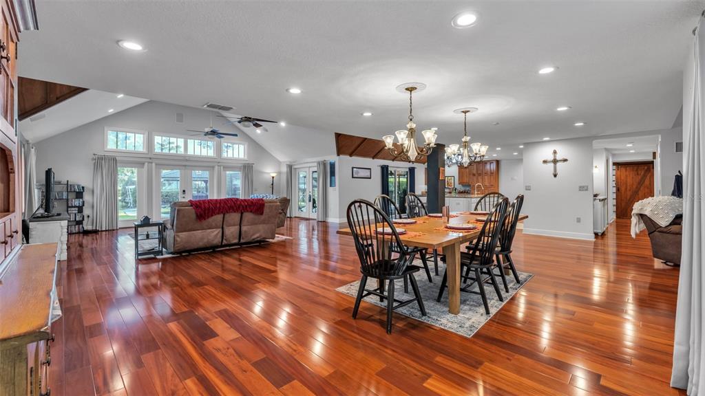 1804 Michelle Lane Lakeland, FL 33813 - Photo 19 of 83 a view of a dining room with furniture and wooden floor